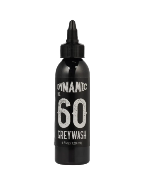 A black bottle labeled 'DYNAMIC WASH 60 GREY WASH' with a dropper cap, indicating it is a product for tattooing or piercing.
