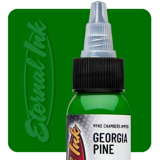 Bottle of tattoo ink labeled 'Georgia Pine' with 'Eternal Ink' branding on a green background.