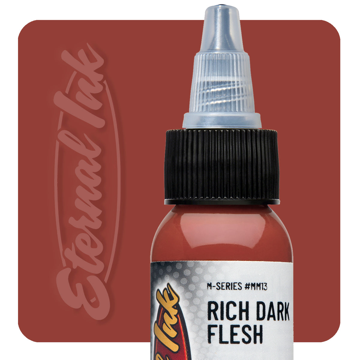 Bottle of Rich Dark Flesh tattoo ink with 'Eternal Ink' branding on a brown background