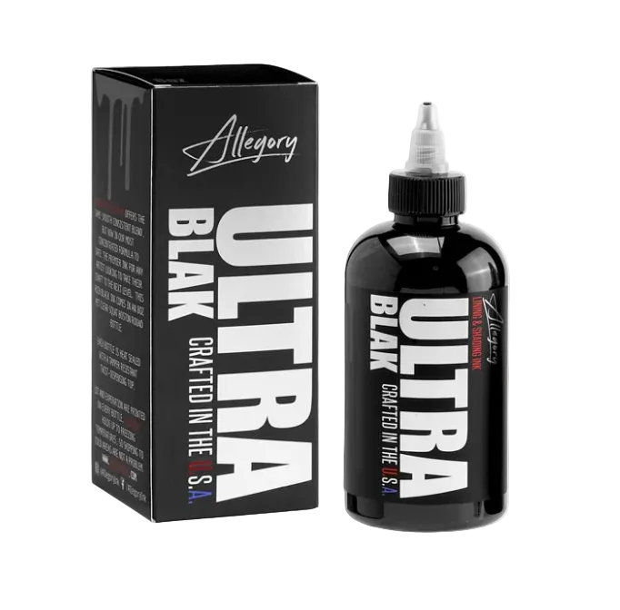 A bottle of Ink Allegory ULTRA BLAK tattooing ink next to its black packaging box, with the product name and the word 'Crafted in the USA' displayed.