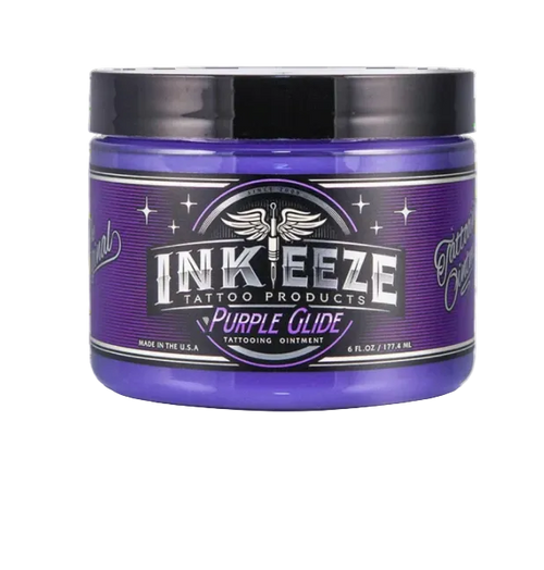 A container of Inkeeze Purple Glide tattooing glycerin, 6 oz size, with a purple label.
