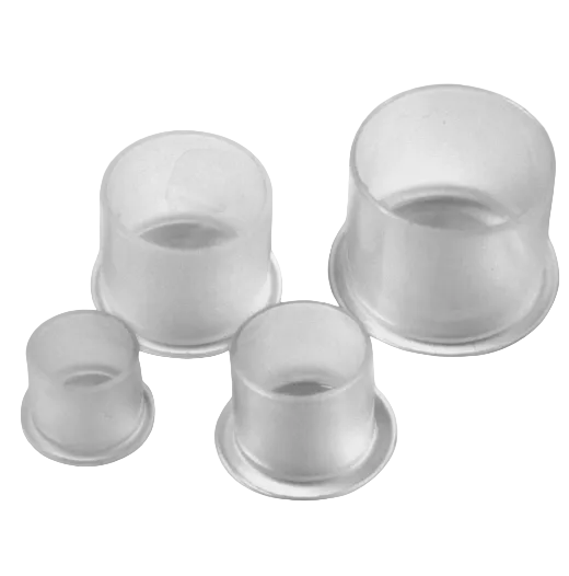 A set of four small, clear ink caps for tattooing, displayed on a white background.