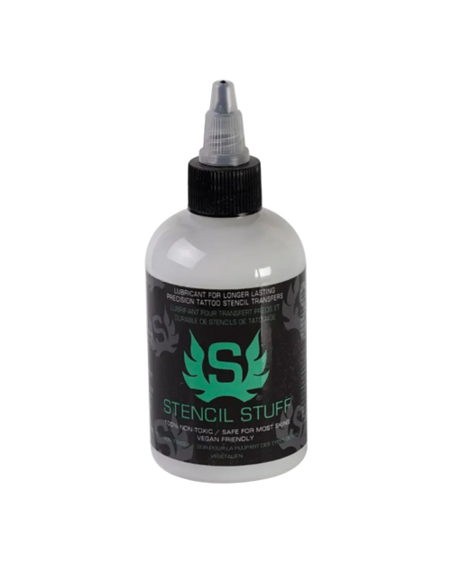 A bottle of Stencil Stuff tattooing ink by Union Tattoo Supply, with a white background and a green label featuring a graphic of a butterfly and text detailing the product as 8 oz.
