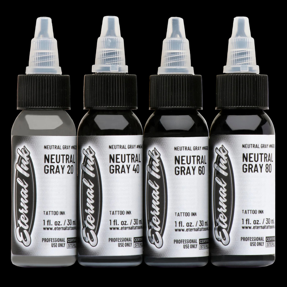 Four bottles of Eternal Ink neutral gray tattoo ink on a white background